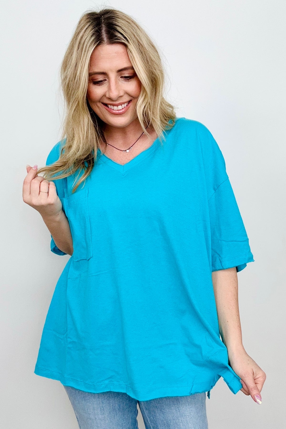 Zenana Oversized Front Pocket Raw Edge High-Low Hem Top